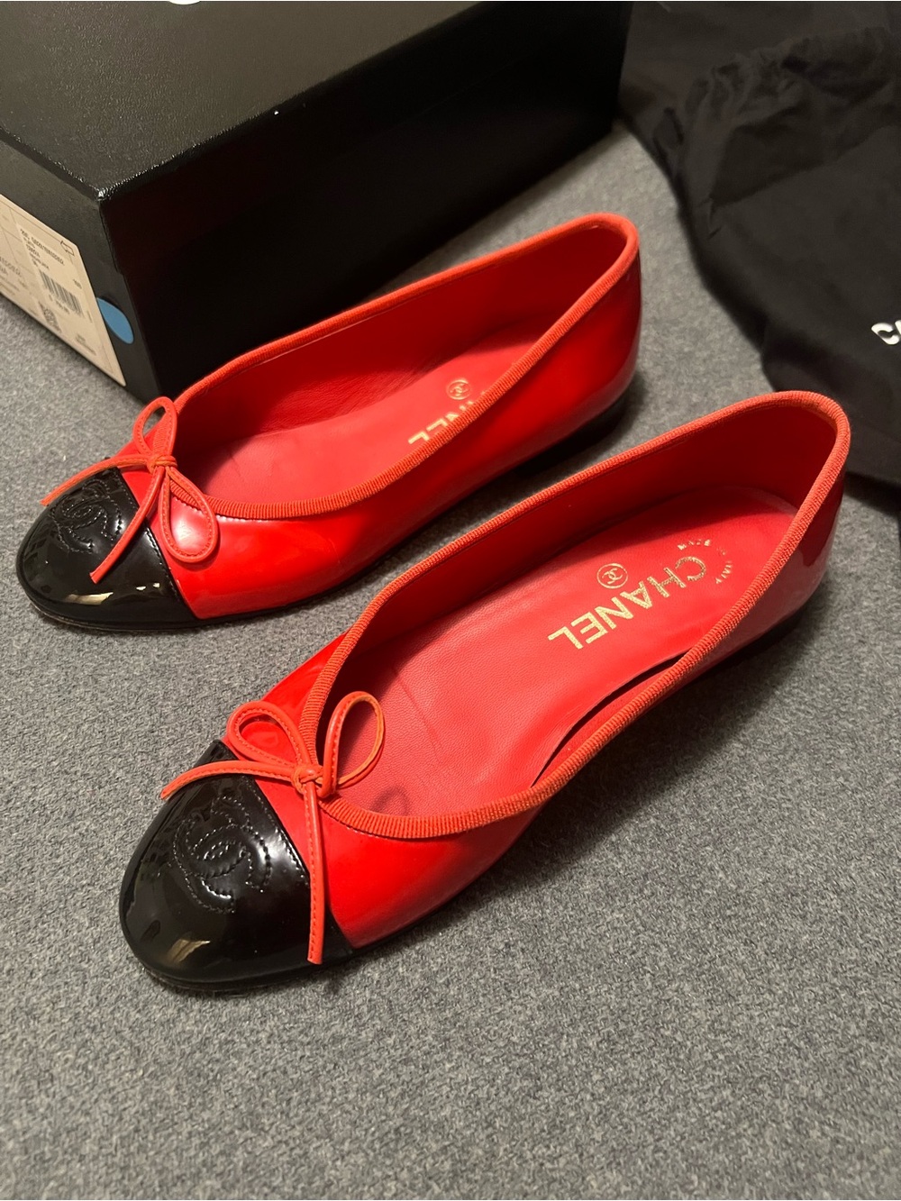 CHANEL Red Patent Leather CC Ballet Flats with Black Cap Toe